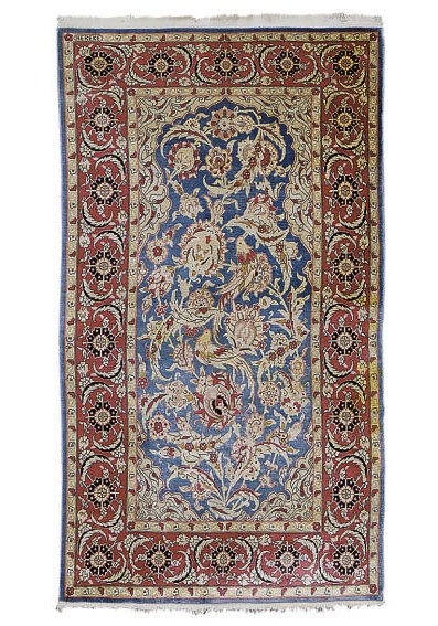 A SILK HEREKE RUG,