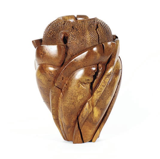 A CARVED WOOD VASE,