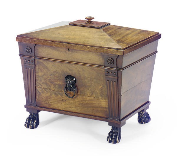 A REGENCY MAHOGANY AND PART-EBONIZED CELLARETTE,