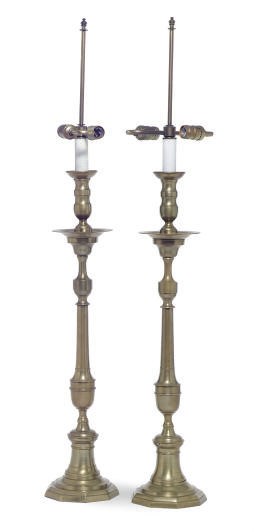 A PAIR OF BRASS CANDLESTICKS MOUNTED AS TABLE LAMPS,