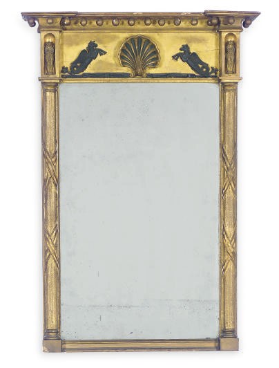 A GILTWOOD AND PART-EBONIZED PIER MIRROR,