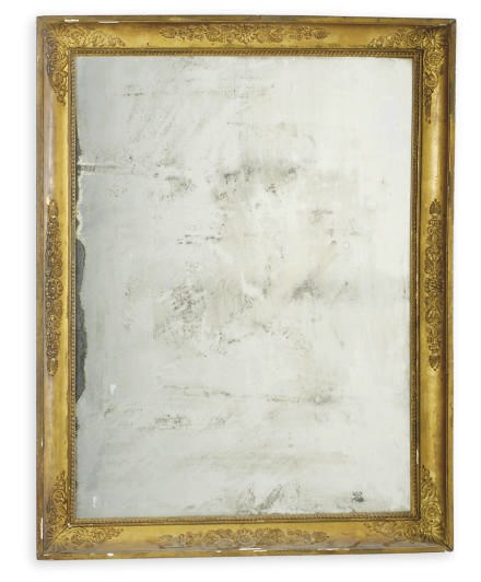 A FRENCH GILTWOOD AND COMPOSITION MIRROR,