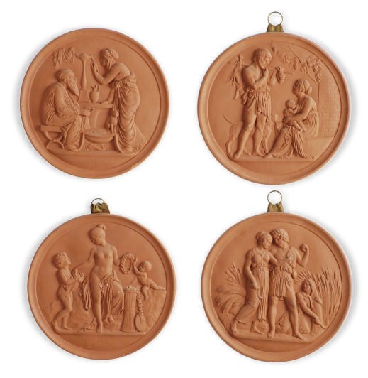 A SET OF FOUR PAINTED PLASTER ROUNDELS,