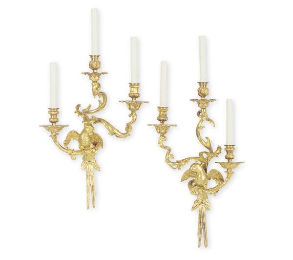 A SET OF FOUR GILT-BRONZE FIGURAL THREE-LIGHT WALL LIGHTS,