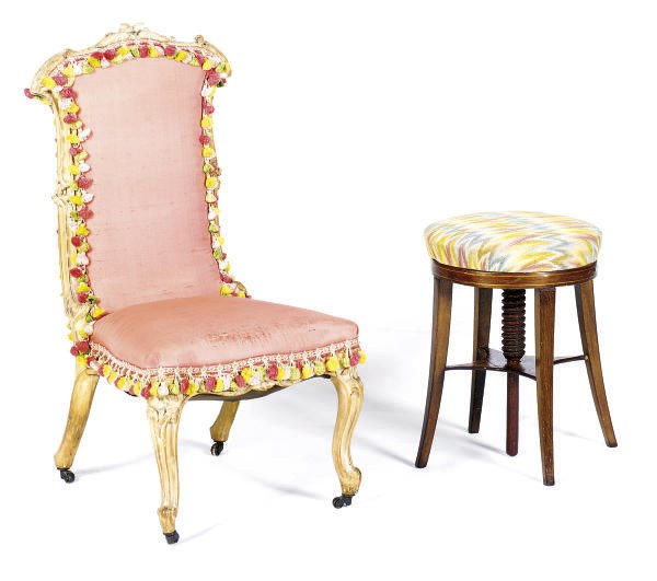 A CONTINENTAL LIMED-WOOD AND UPHOLSTERED SLIPPER CHAIR,