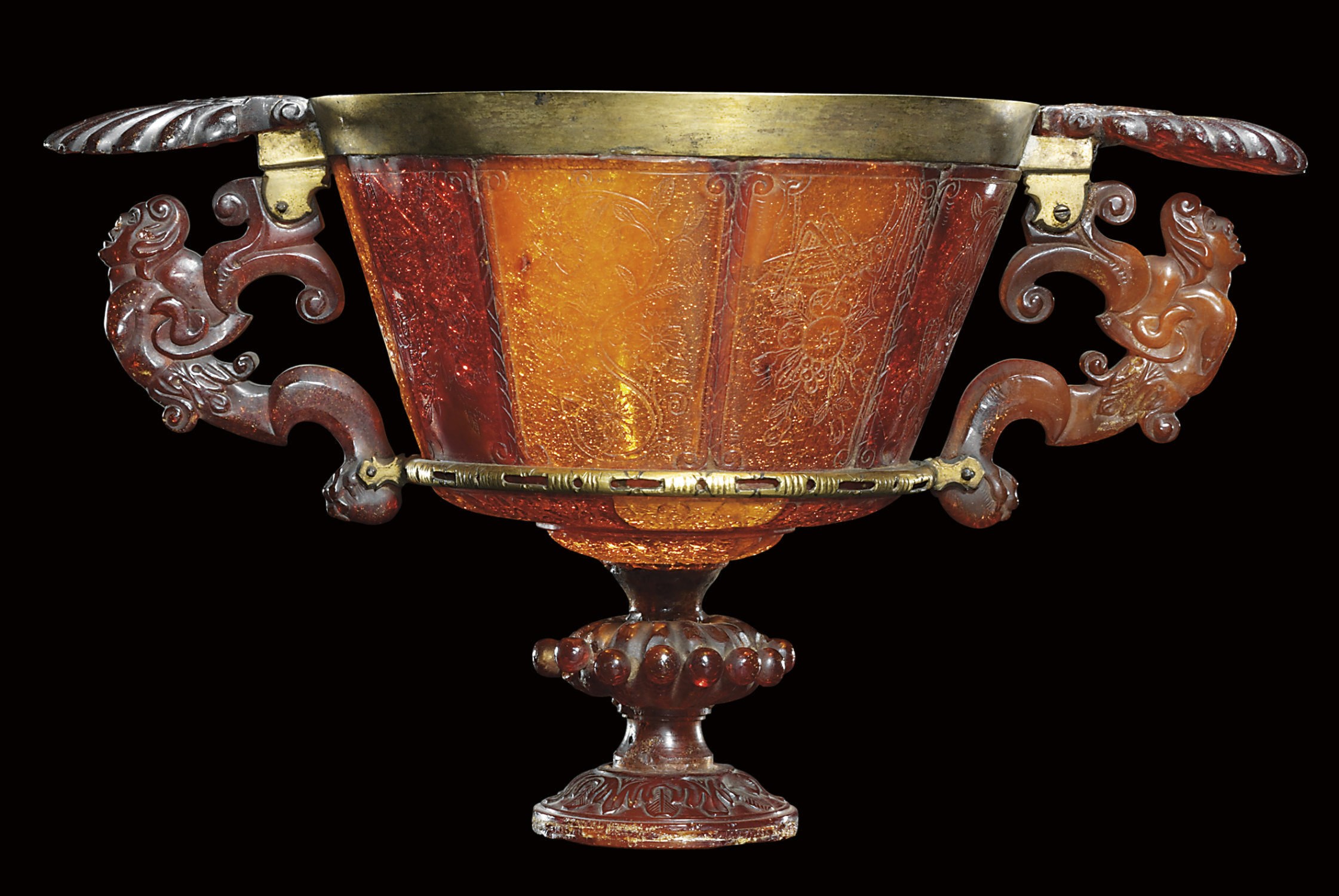 A GILT-BRASS MOUNTED AMBER TWO-HANDLED CUP