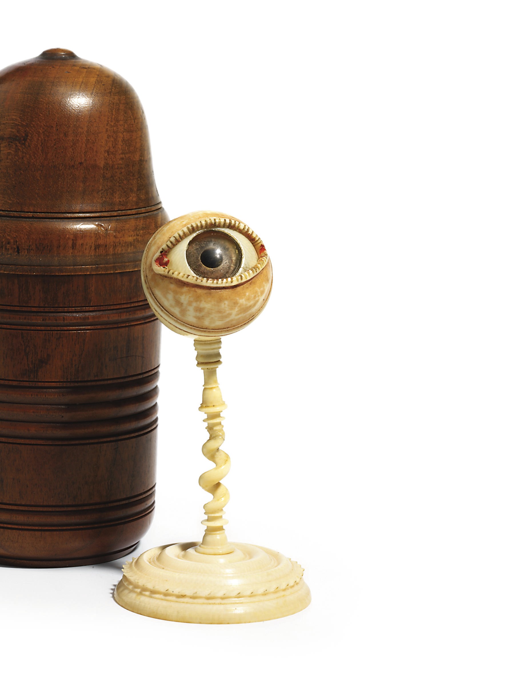 A CARVED IVORY, WOOD AND GLASS ANATOMICAL MODEL OF AN EYE