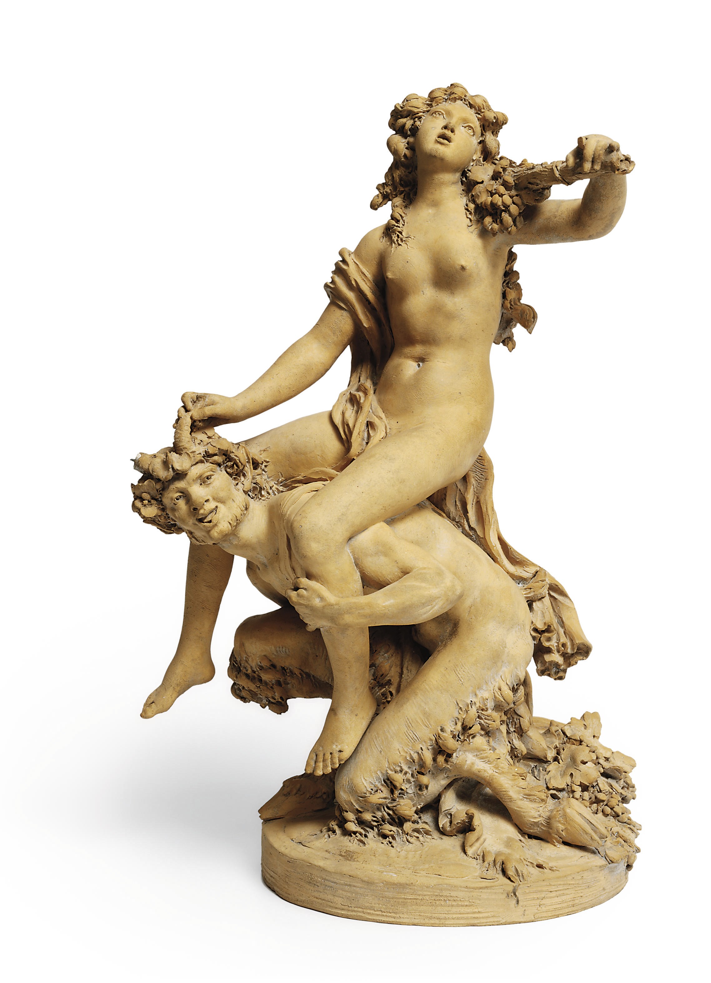 A TERRACOTTA GROUP OF A FROLICKING MAIDEN AND SATYR