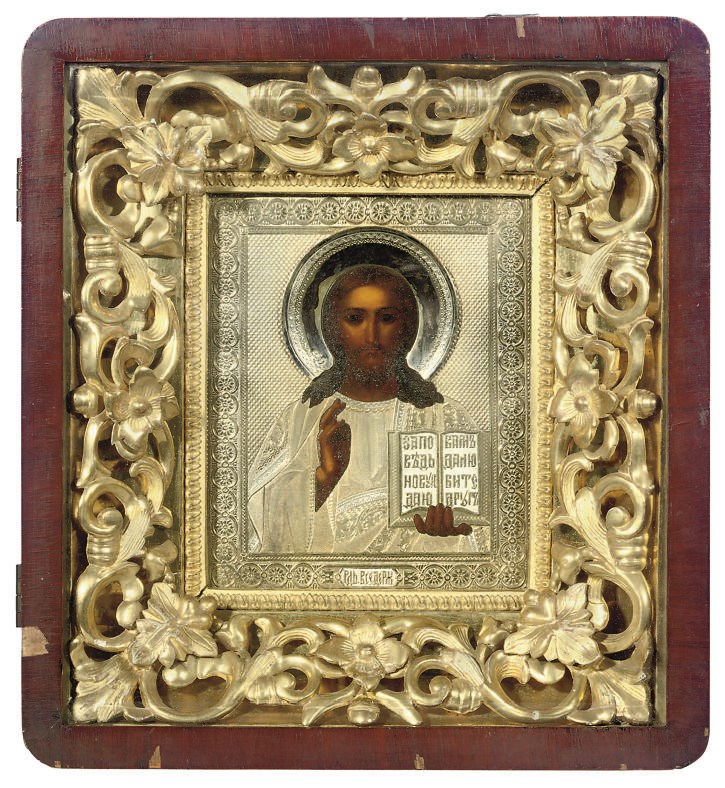 CHRIST PANTOKRATOR WITH A PARCEL-GILT OKLAD ENCASED IN A GLAZED KYOT INCLUDING A CARVED AND GILDED FRAME