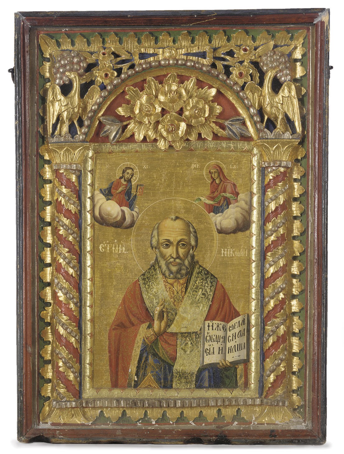 SAINT NICHOLAS ENCASED IN A CARVED GILT POLYCHROME FRAME