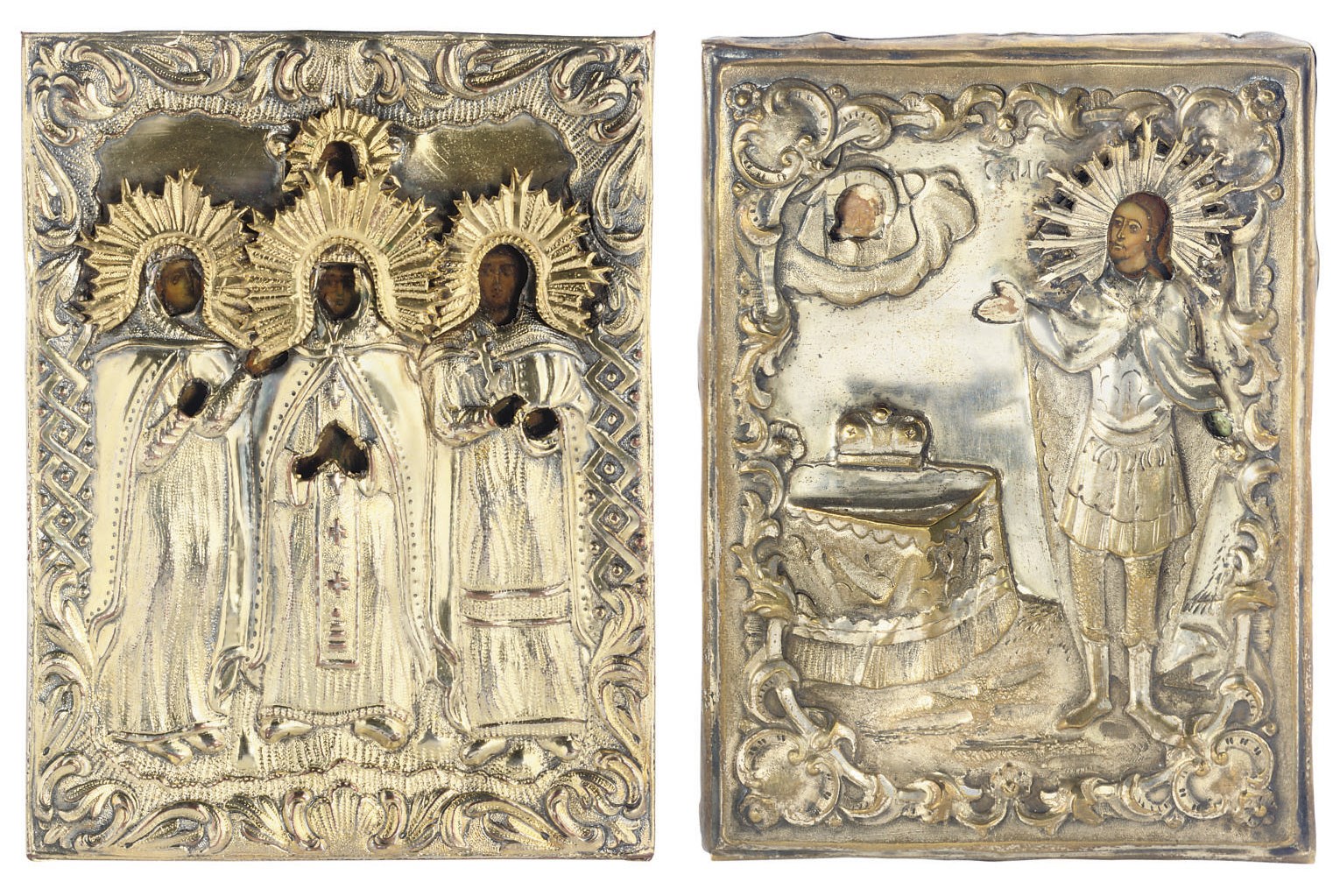 AN ICON OF THREE SAINTS IN SUPPLICATION AND AN ICON OF ST. ALEXANDER NEVSKY, BOTH TRAVELLING ICONS WITH A GILT METAL OKLAD