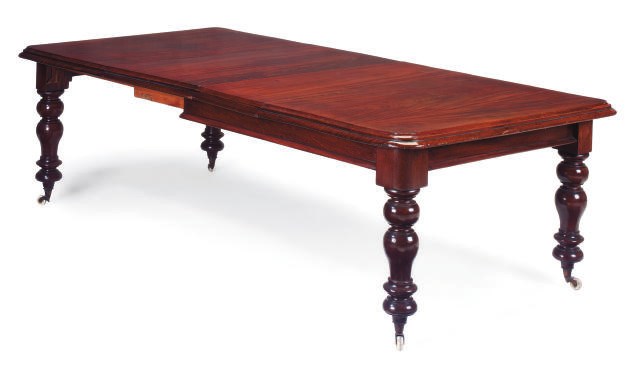 A MID-VICTORIAN MAHOGANY EXTENDING DINING-TABLE