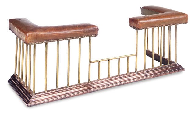 A LATE VICTORIAN COPPER, BRASS AND LEATHER MOUNTED CLUB FENDER