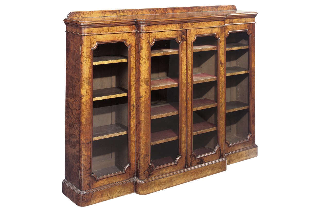 A MID VICTORIAN BURR WALNUT BREAKFRONT BOOKCASE