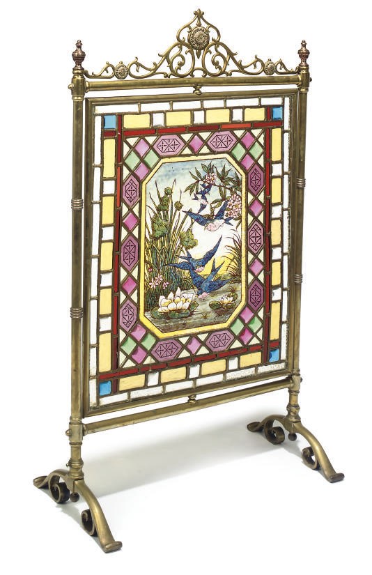 A LATE VICTORIAN STAINED GLASS AND BRASS FIRESCREEN