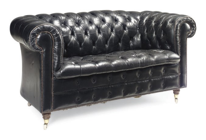 A LEATHER UPHOLSTERED CHESTERFIELD TYPE SOFA