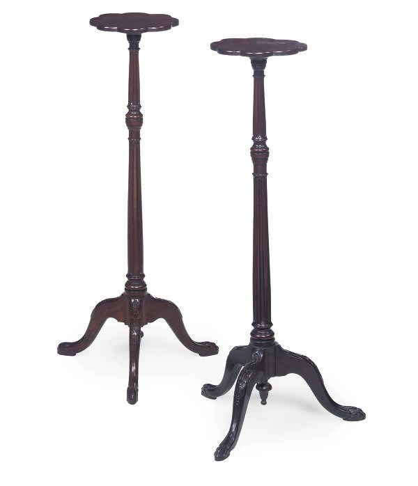 A MATCHED PAIR OF MAHOGANY CANDLE STANDS