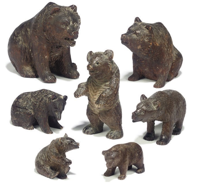 A GROUP OF SEVEN SWISS 'BLACK FOREST' CARVED WOOD MODELS OF BEARS