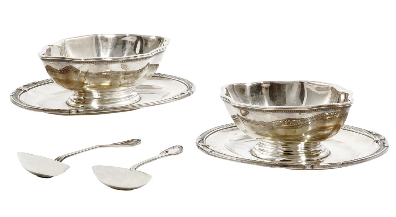 A PAIR OF FRENCH SILVER SAUCE TUREENS ON STANDS AND A PAIR OF SAUCE LADLES EN SUITE