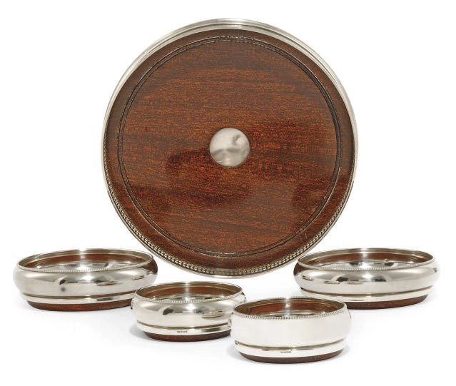 A CIRCULAR SILVER-MOUNTED MAHOGANY GALLERY TRAY