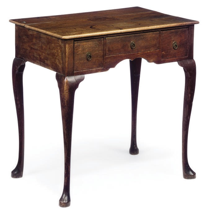 A GEORGE II OAK LOWBOY
