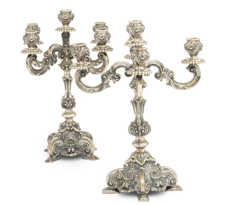 A PAIR OF PORTUGUESE SILVER FIVE-LIGHT CANDELABRA