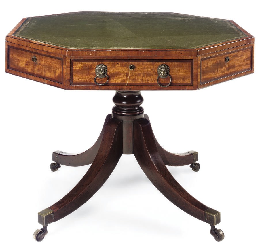 A LATE GEORGE III MAHOGANY OCTAGONAL DRUM TABLE