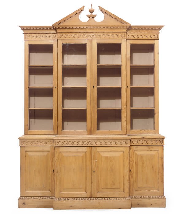 A PINE BREAKFRONT BOOKCASE