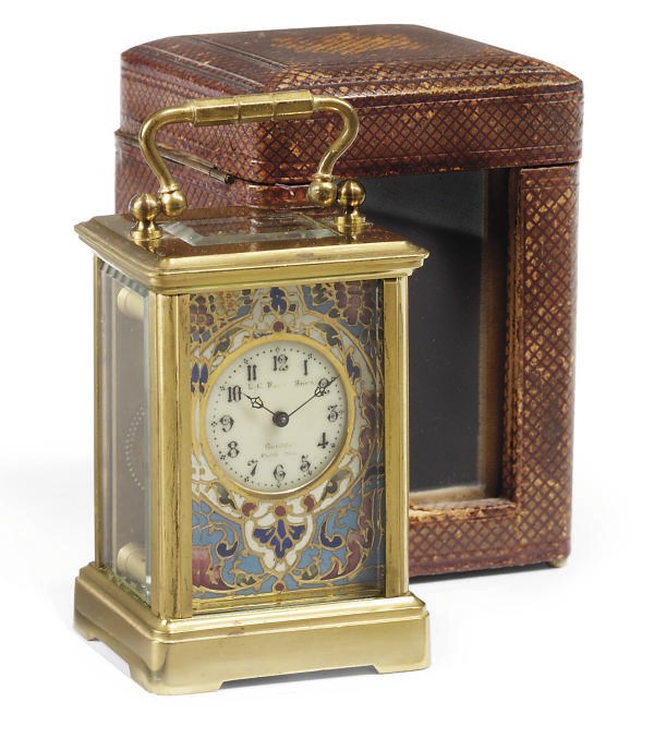 A FRENCH MINIATURE BRASS CARRIAGE TIMEPIECE WITH CHAMPLEVÉ ENAMEL DIAL MASK