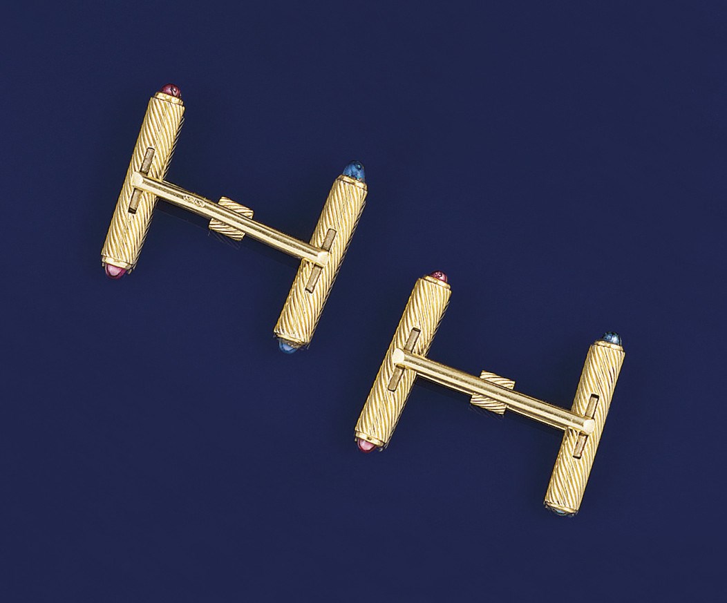 A pair of sapphire and ruby cufflinks, by Cartier