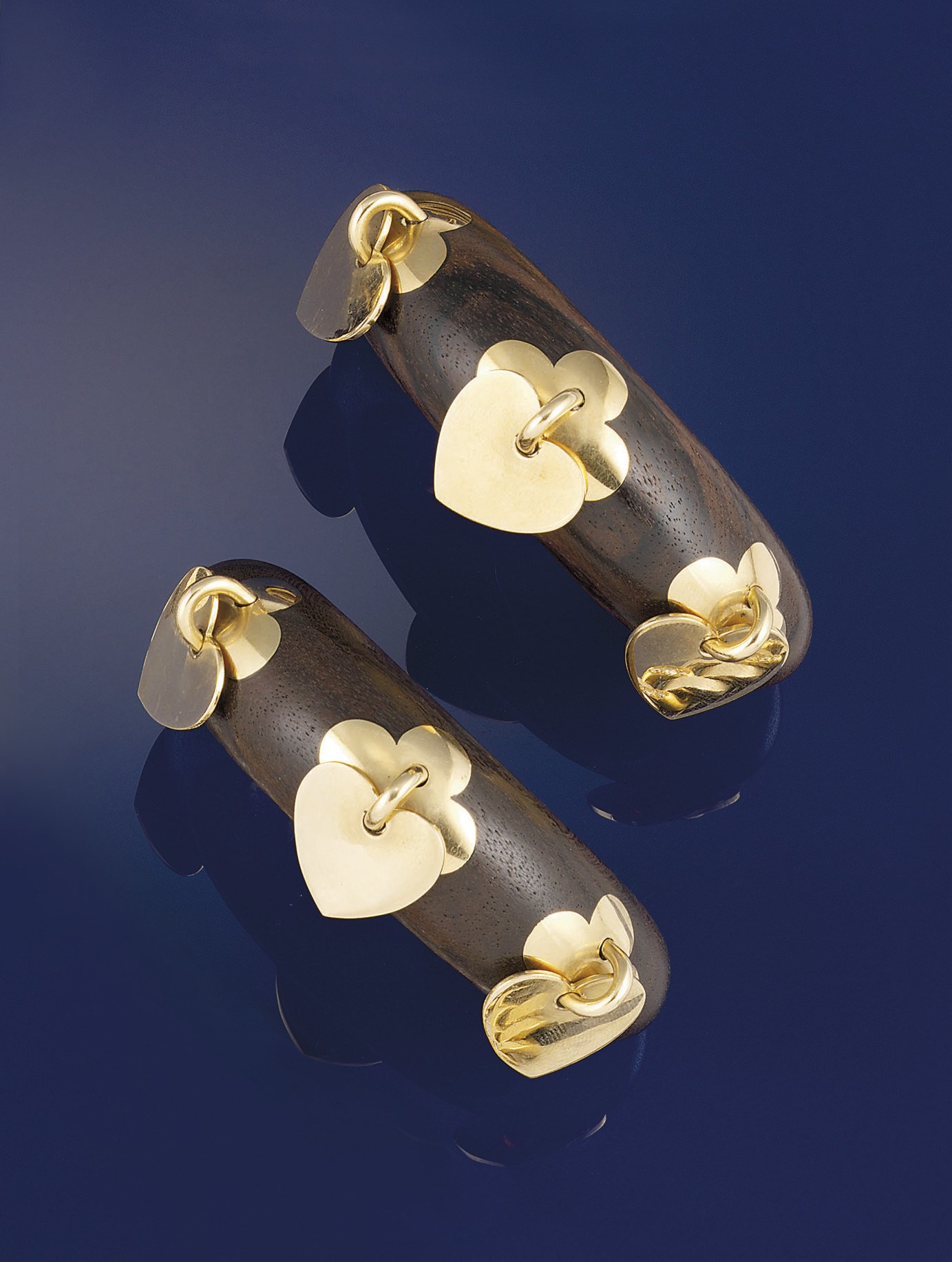 A pair of rosewood bangles, by Van Cleef & Arpels
