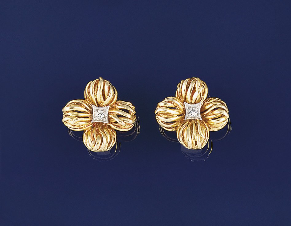 A pair of diamond earclips by Van Cleef & Arpels