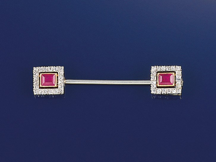 A French, Art Deco diamond and ruby jabot pin, by Cartier