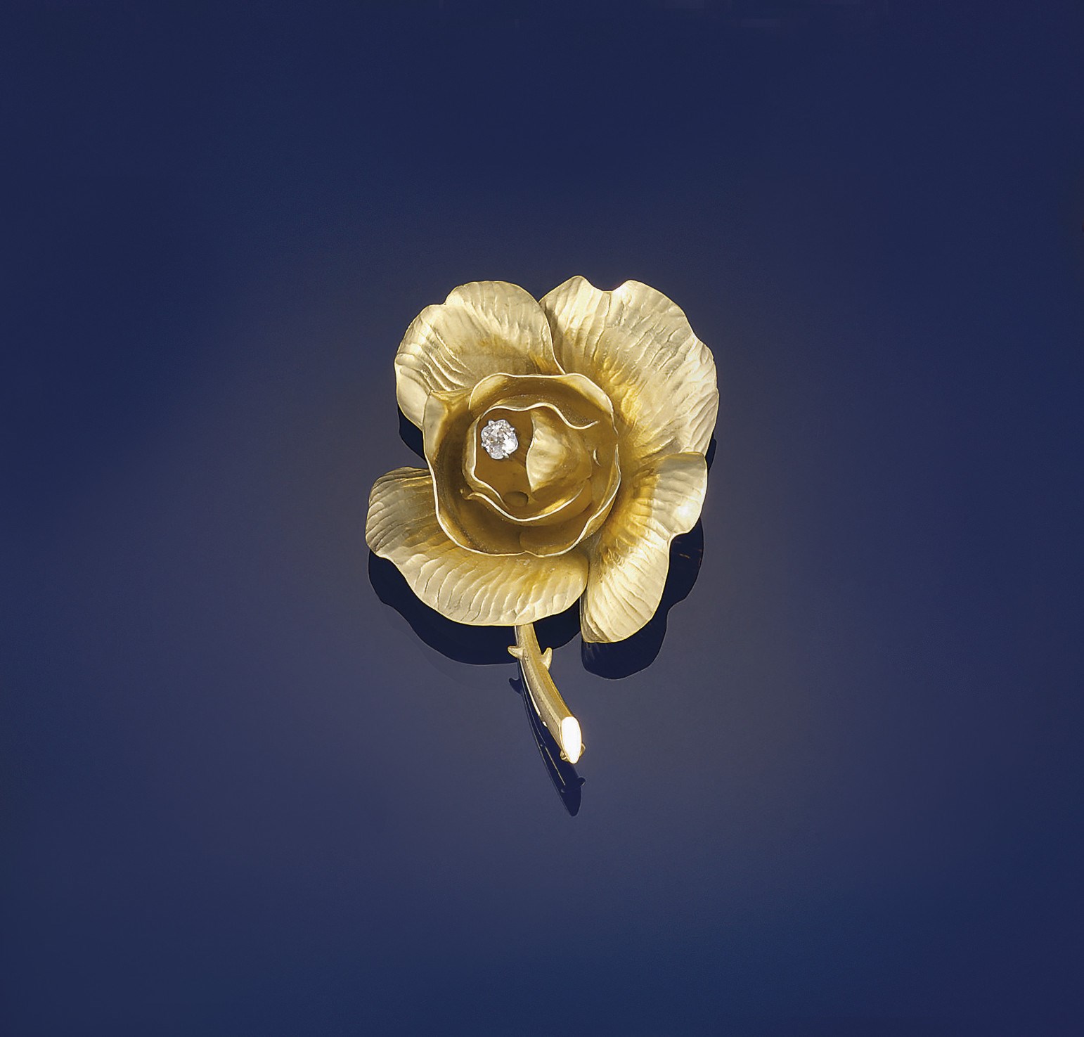 A diamond flower brooch, by Fred