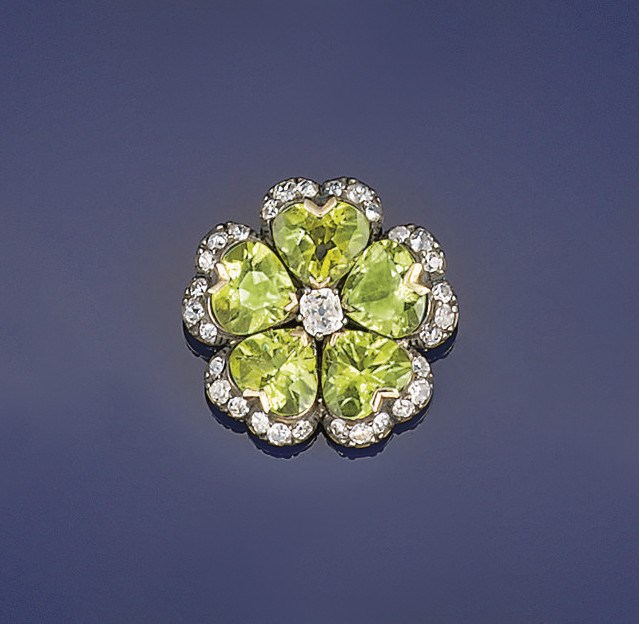 A peridot and diamond brooch
