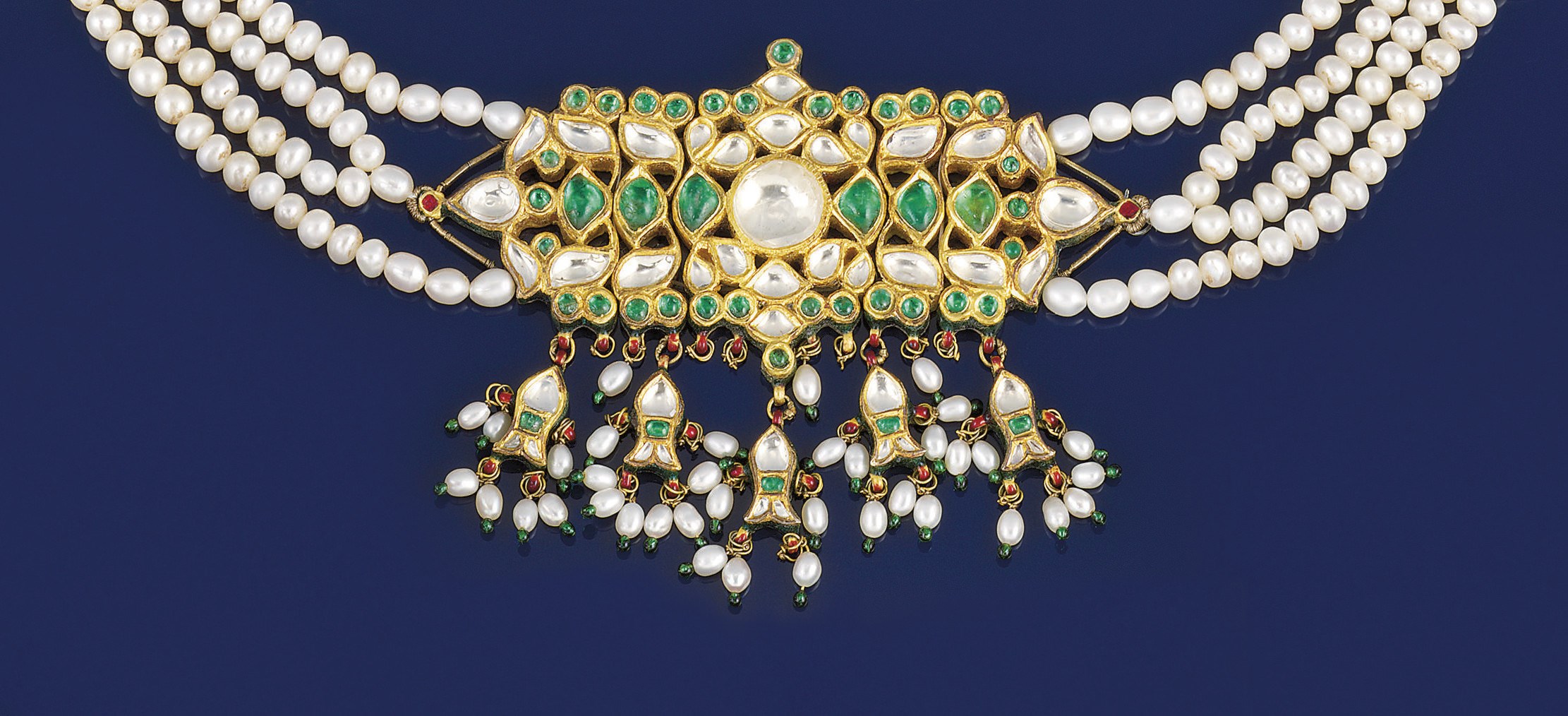An emerald, colourless sapphire, enamel and cultured pearl necklace