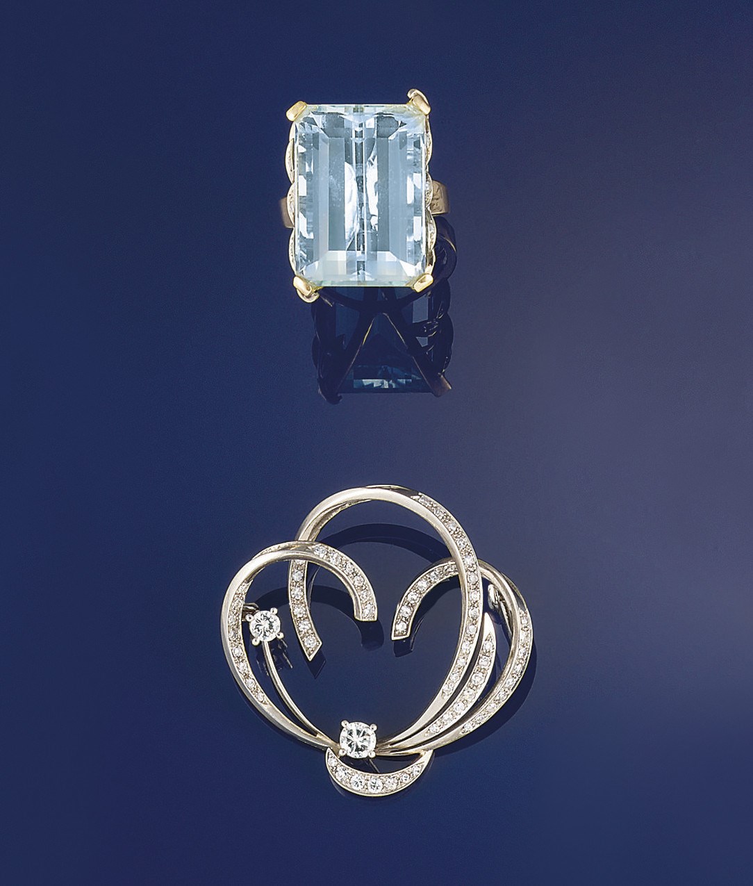 An aquamarine single stone ring and a diamond brooch