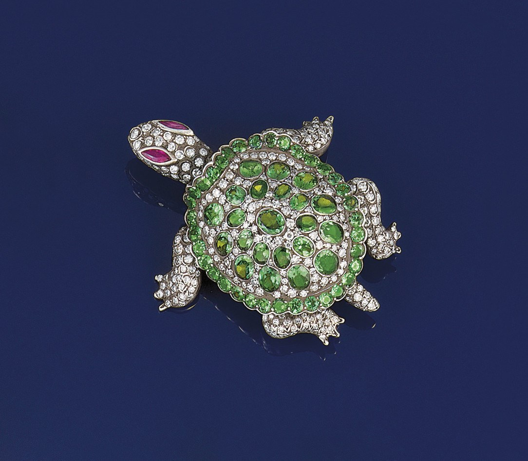 A diamond, garnet and ruby novelty brooch