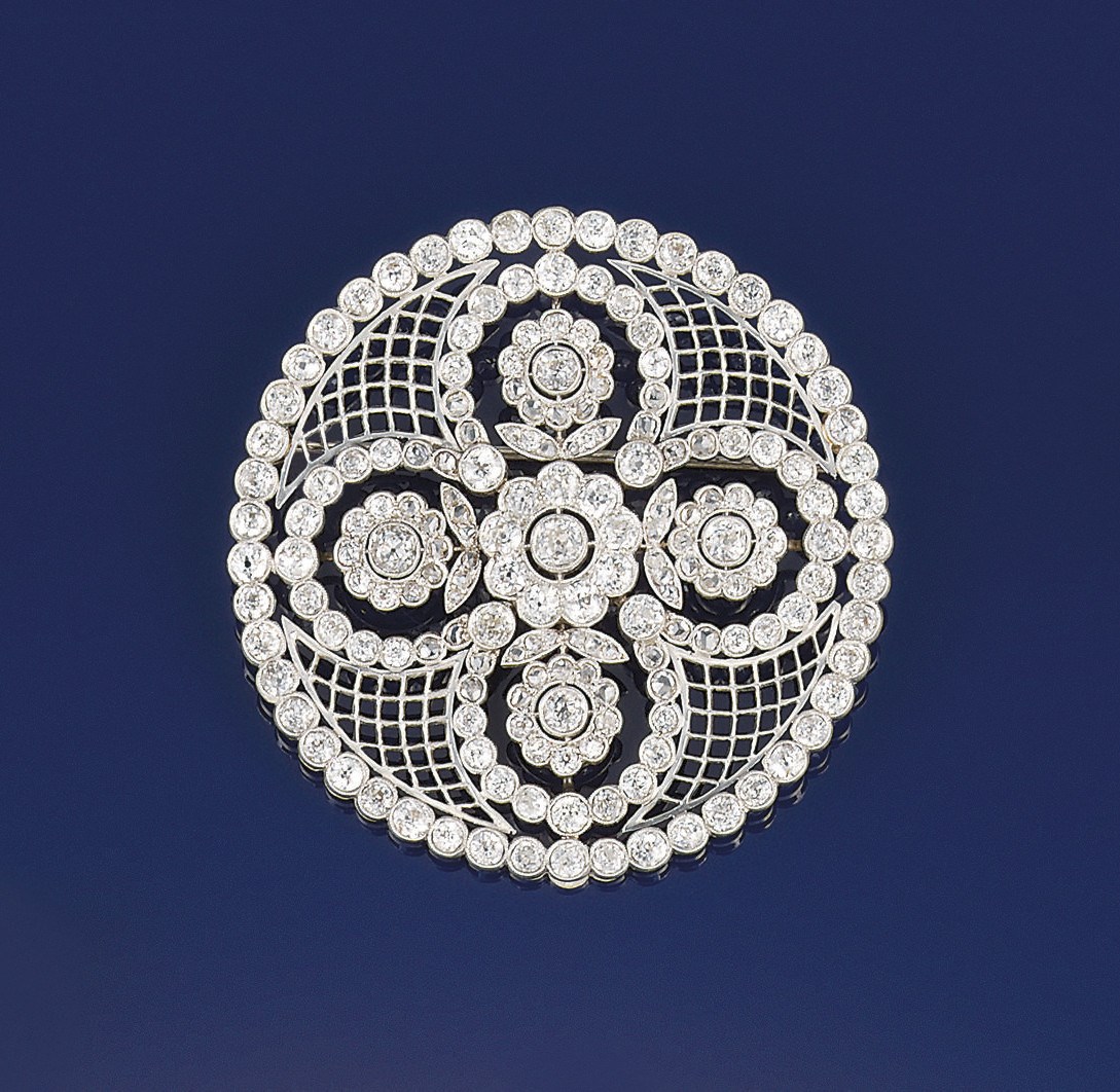 A Belle Epoque platinum and diamond cluster rosette brooch