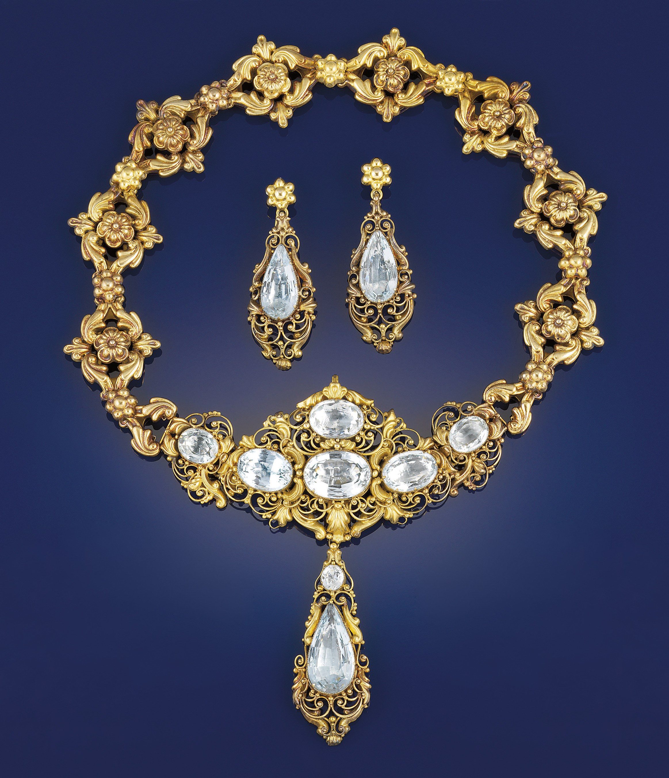 An early 19th century gold and foiled aquamarine parure