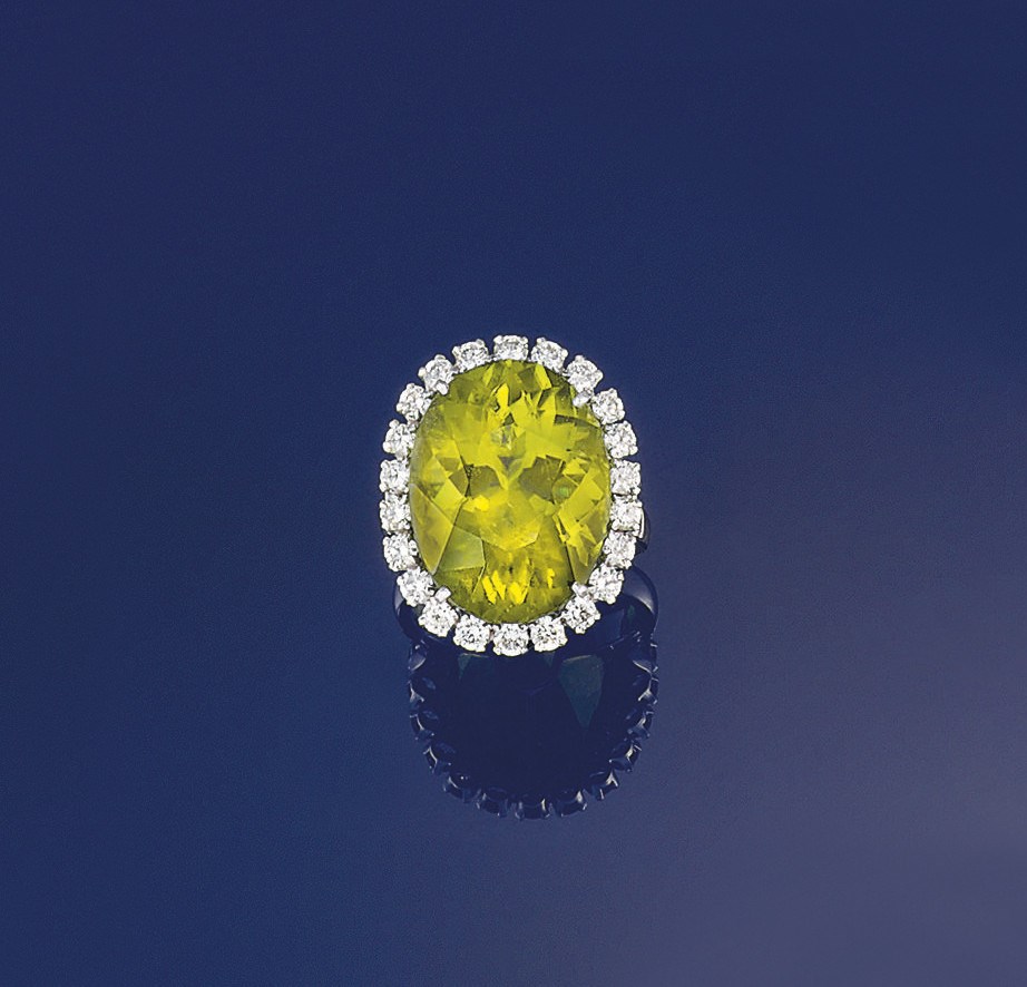 A peridot and diamond cluster ring