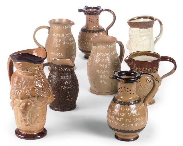 EIGHT ROYAL DOULTON BROWN STONEWARE JUGS