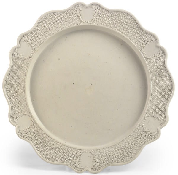 A STAFFORDSHIRE SALTGLAZE WHITE STONEWARE PRESS-MOULDED LARGE DISH
