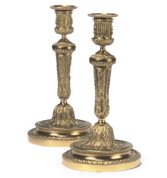 A PAIR OF GILT-BRONZE CANDLESTICKS