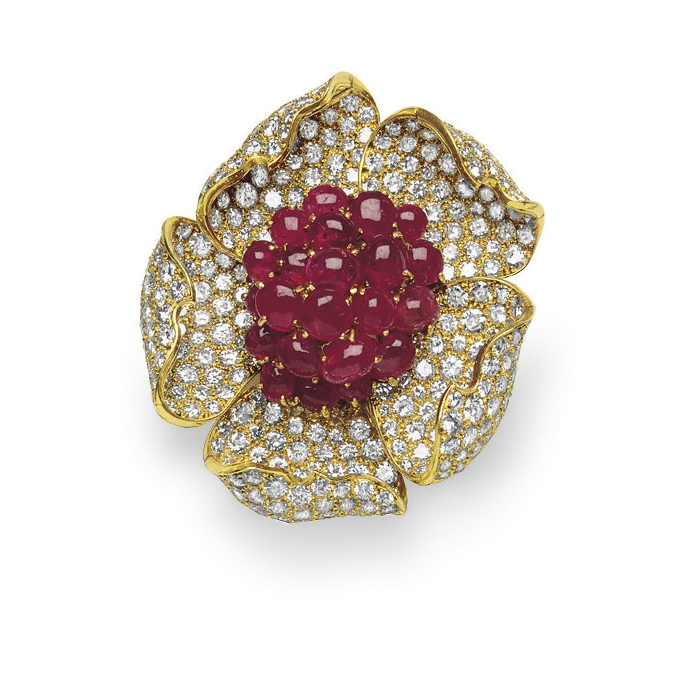 A RUBY AND DIAMOND FLOWER BROOCH