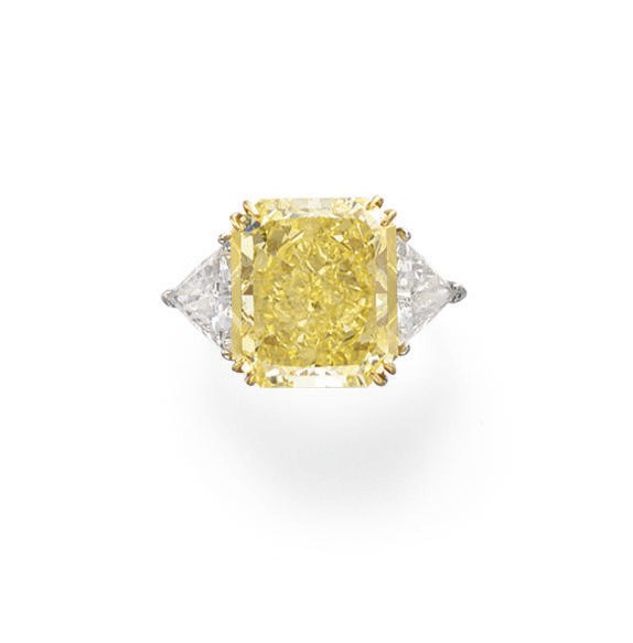 A COLORED DIAMOND AND DIAMOND RING