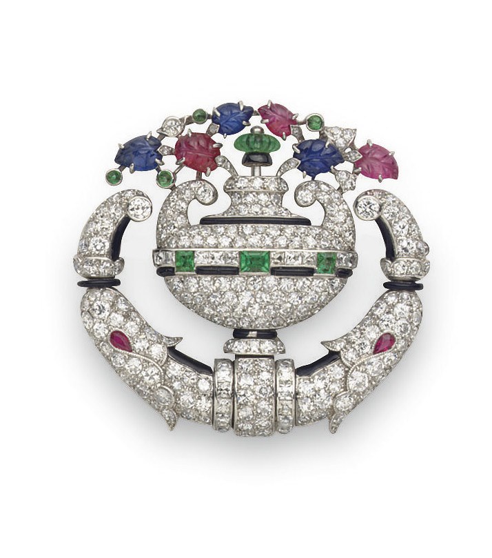 AN ART DECO DIAMOND AND MULTI-GEM LAPEL WATCH, BY TIFFANY & CO.