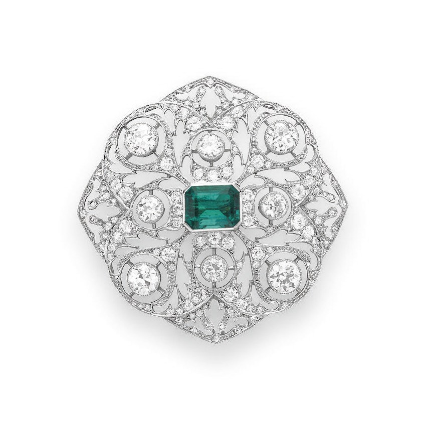 AN EMERALD AND DIAMOND BROOCH