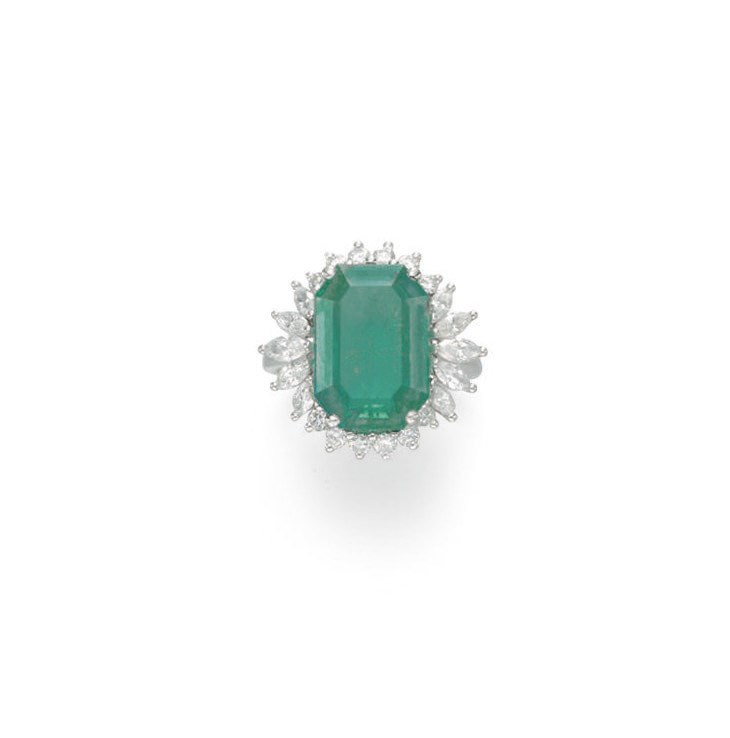 AN EMERALD AND DIAMOND RING