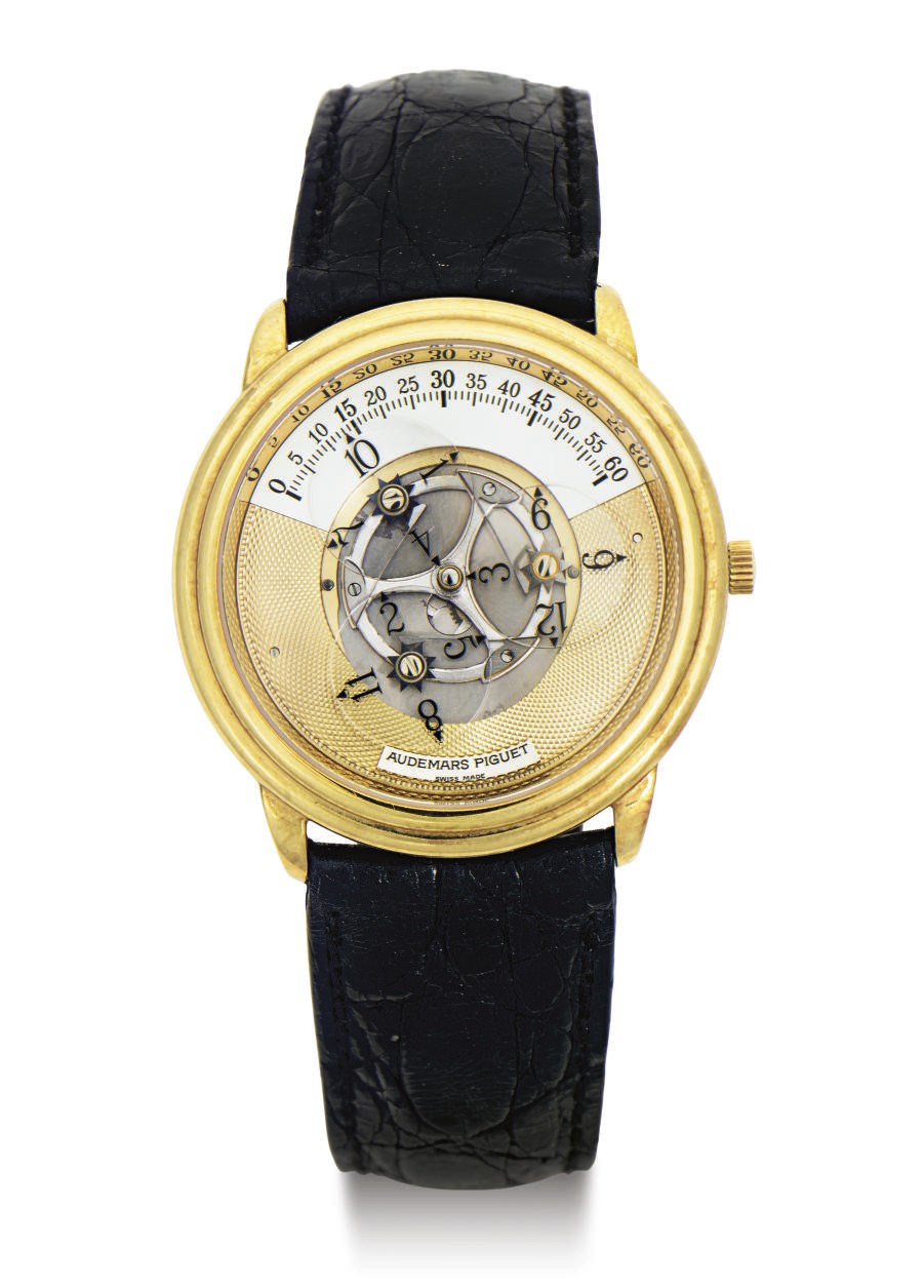 AUDEMARS PIGUET. AN 18K GOLD AUTOMATIC WANDERING HOUR DIGITAL WRISTWATCH